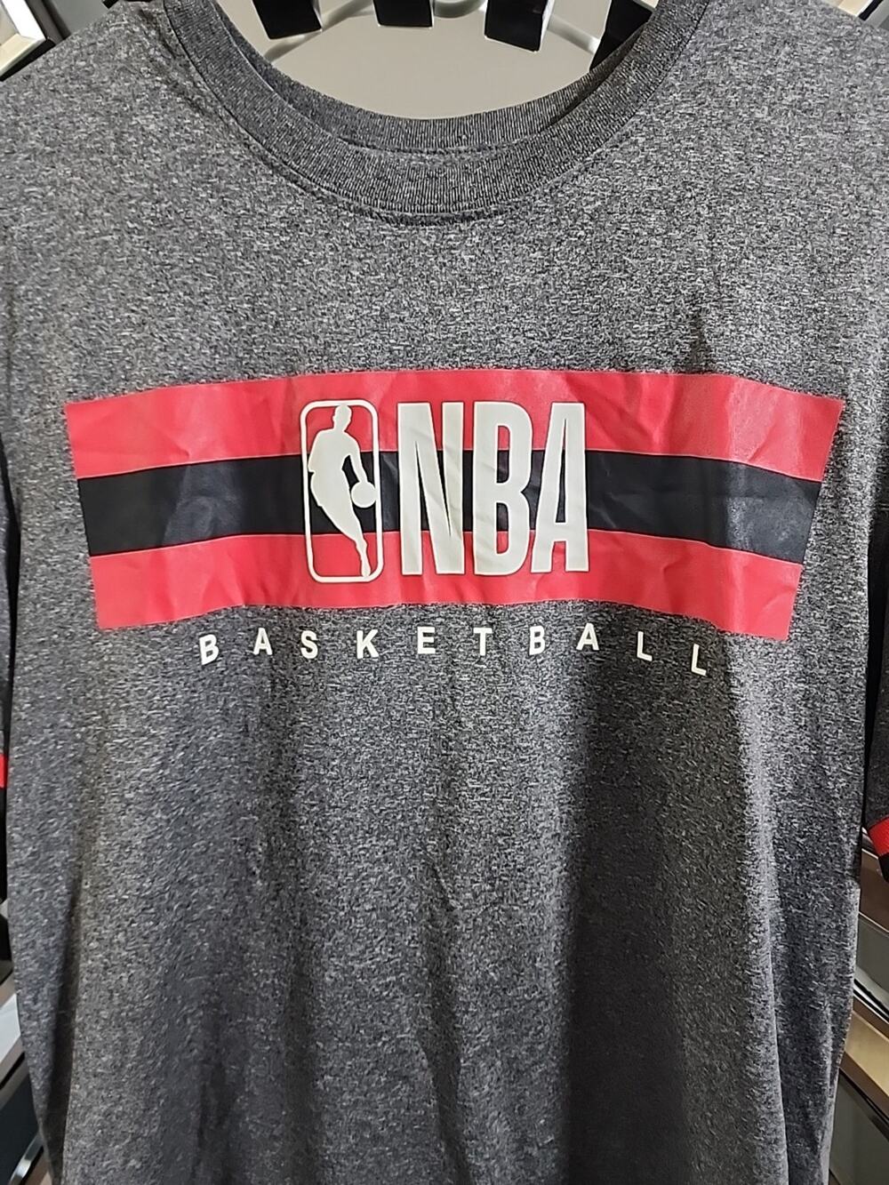NBA Basketball, medium Gray T-shirt.\nRed and black logo official